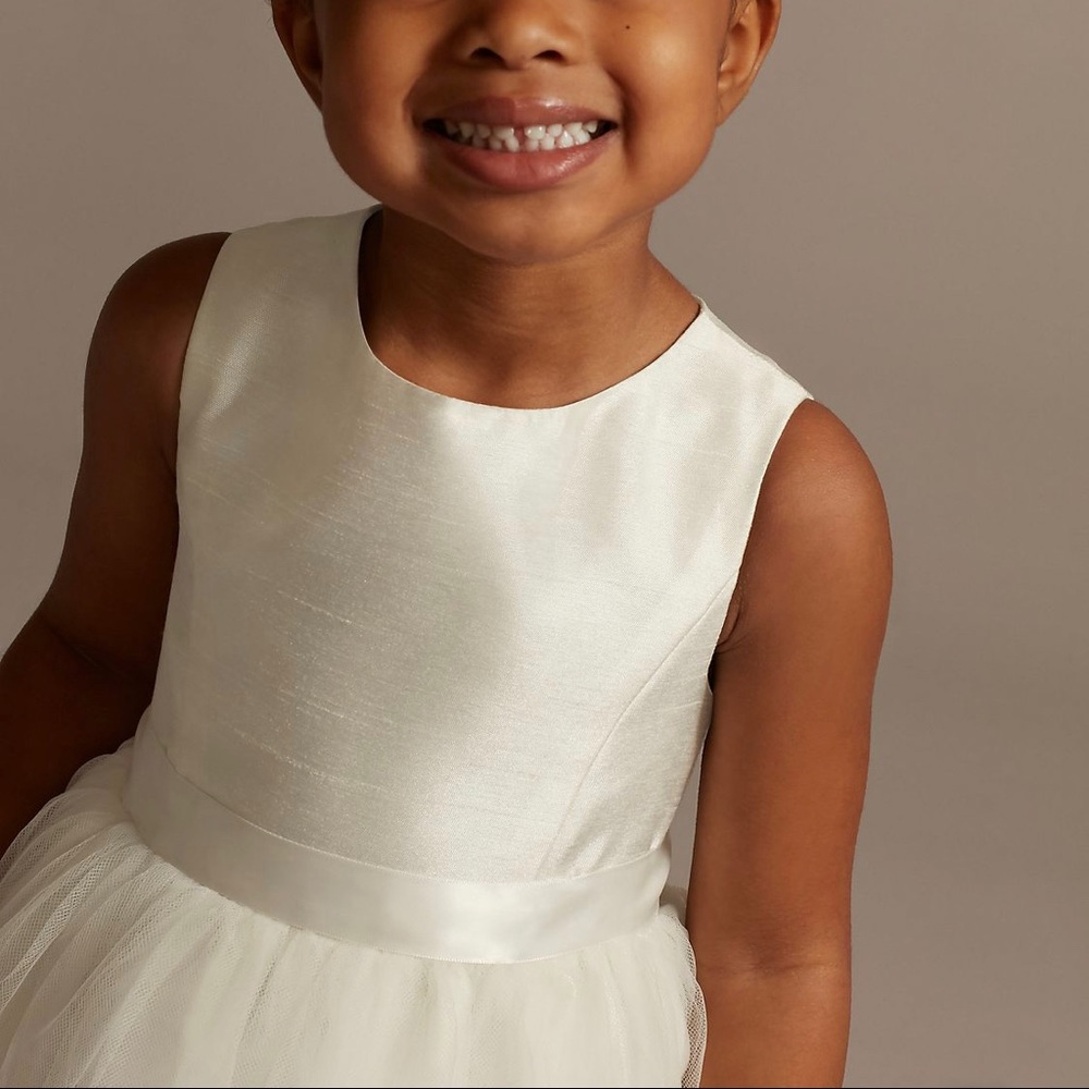 Ivory flower girl dress with ribbon. Tulle skirt.